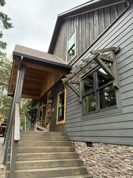 Front exterior windows after cleaning at a Drasco Arkansas lakehouse