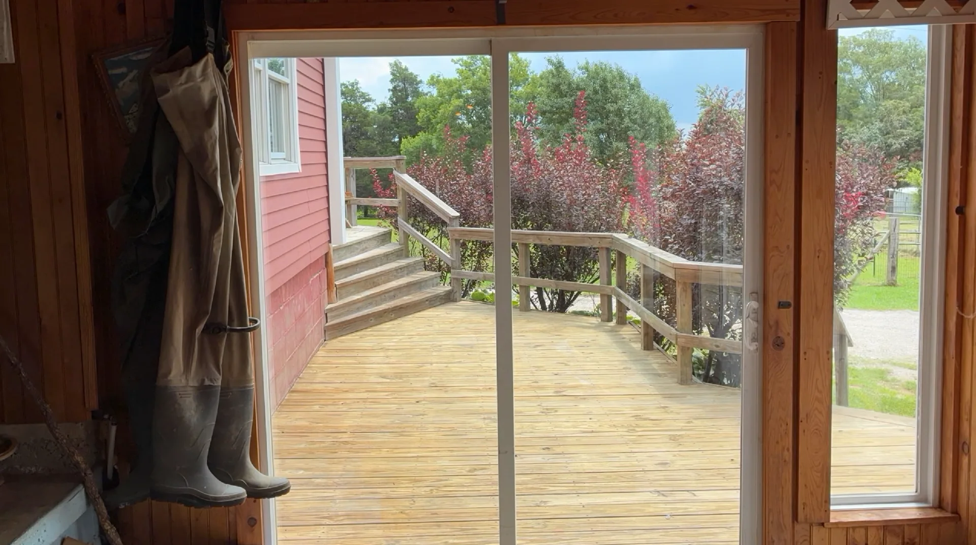Main sunroom windows after cleaning at a Mountain View Arkansas home, looking out to the deck