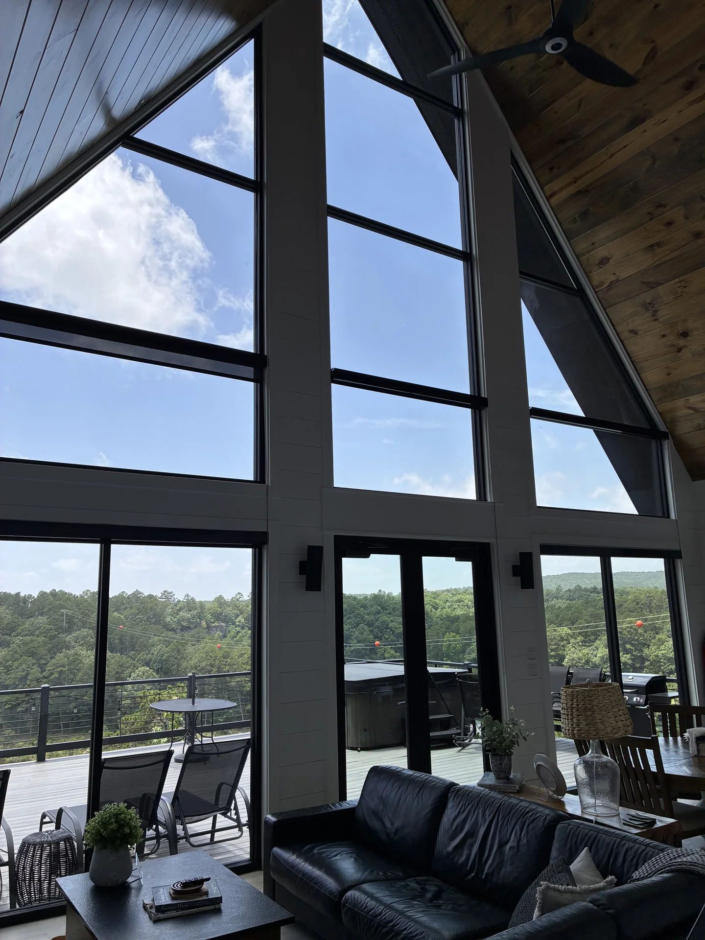 Interior view through cleaned two-story lakeside windows at a Drasco Arkansas short-term rental